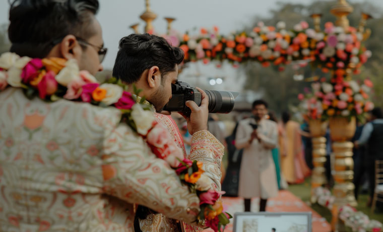 Groom being photographed indian wedding ceremony Rvr school of Photography