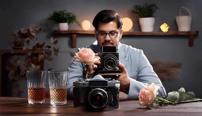 man is taking photo camera with glass beer rvr school of photography