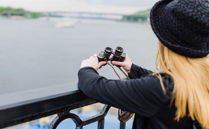 woman at waterfront with binoculars pic clicked by RVR School of Photography