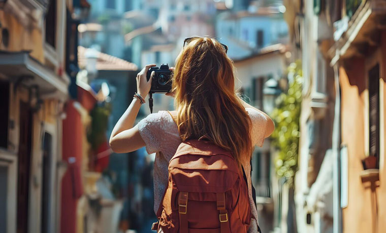 woman with camera is taking picture with camera rvrsp schol of photography