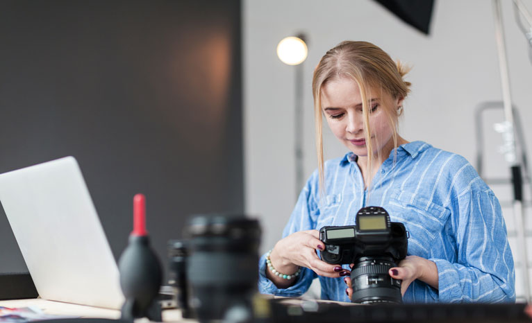 photographer woman her lens standing RVRSP School of Photography