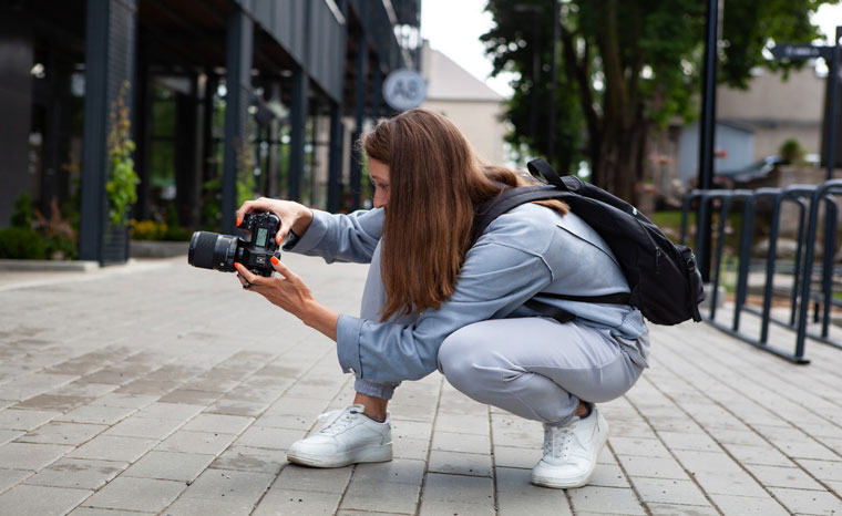 woman with camera taking photos city rvrsp school