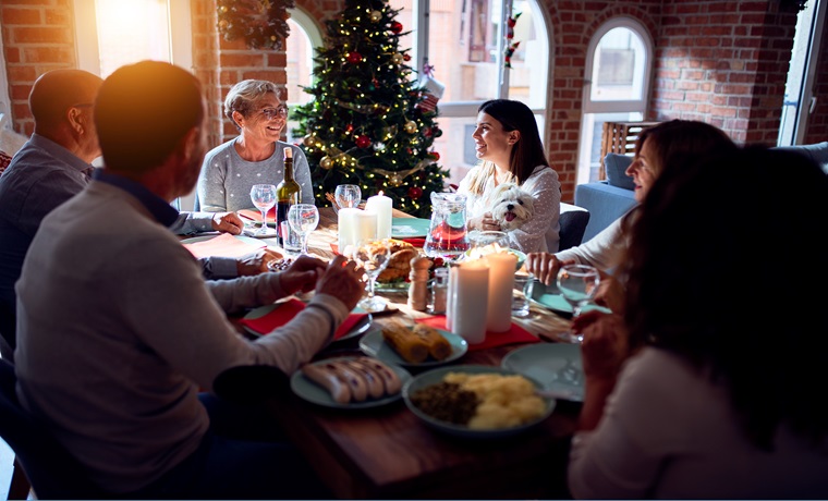 family celebrating christmas with food