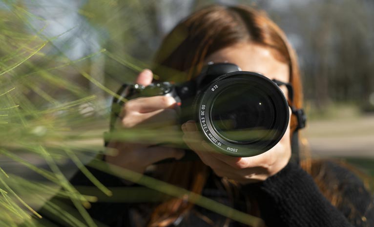 front view photographer with camera